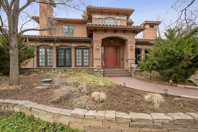 mediterranean / spanish house featuring stucco siding