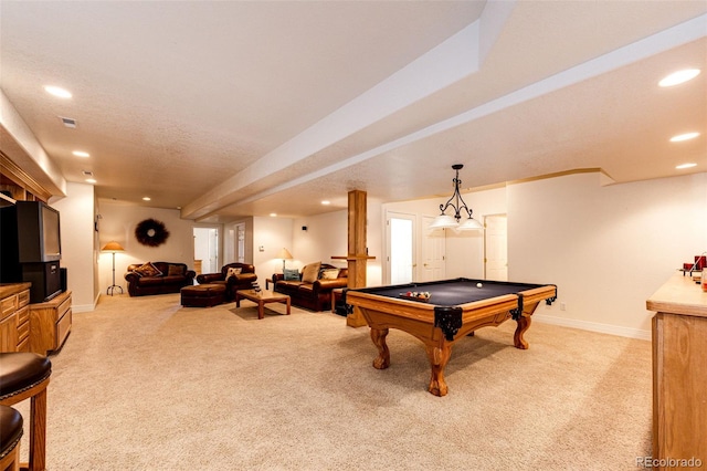 game room with pool table, light colored carpet, and a textured ceiling