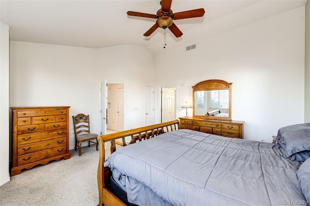 bedroom featuring vaulted ceiling, ceiling fan, and carpet flooring