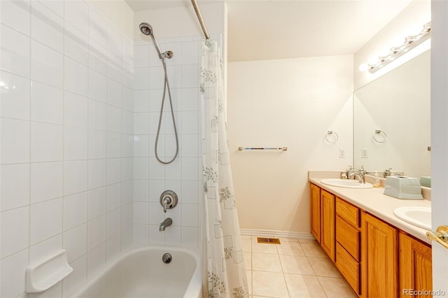 bathroom with vanity, shower / bathtub combination with curtain, and tile patterned flooring