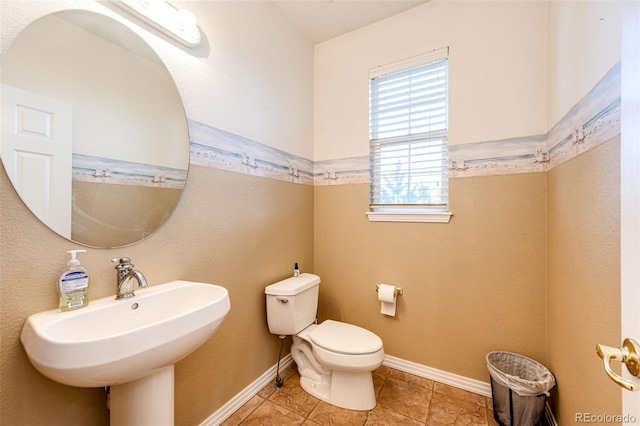 bathroom with sink, tile patterned floors, and toilet