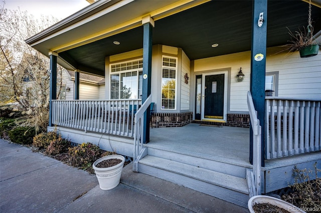 doorway to property with covered porch