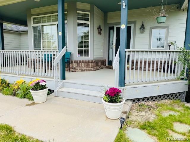 935 Green Gables Cir, Bennett, CO 80102 - entrance to property featuring covered porch