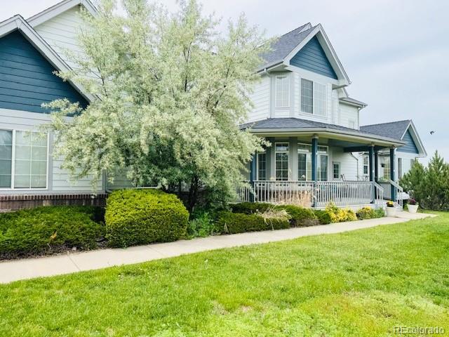 935 Green Gables Cir, Bennett, CO 80102 - victorian home featuring covered porch and a front yard