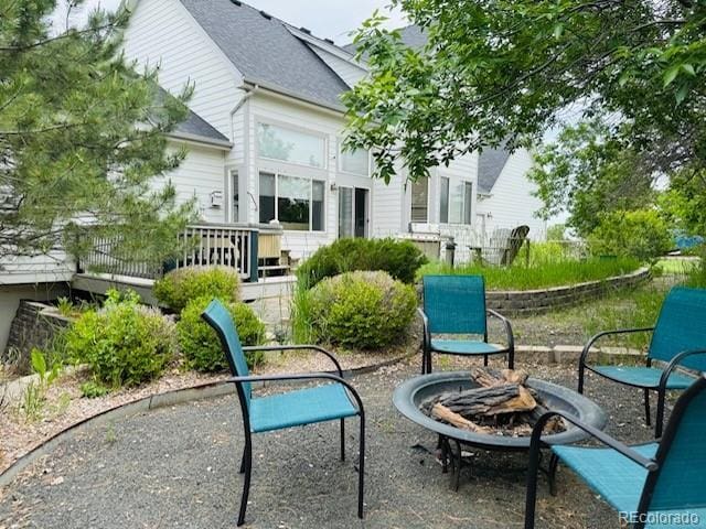 935 Green Gables Cir, Bennett, CO 80102 - view of patio featuring an outdoor fire pit