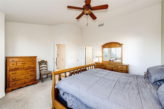 935 Green Gables Cir, Bennett, CO 80102 - bedroom with light carpet, vaulted ceiling, and a ceiling fan