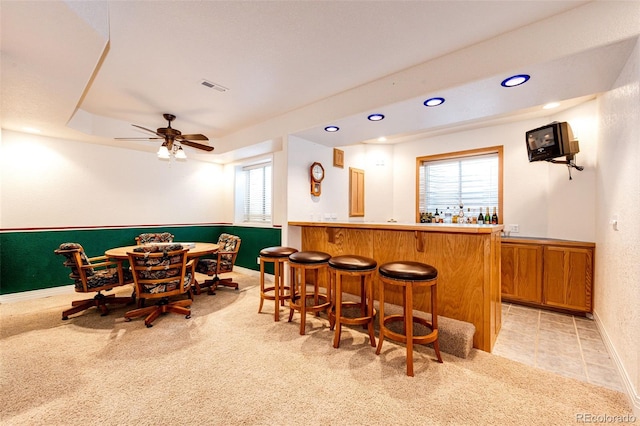 935 Green Gables Cir, Bennett, CO 80102 - indoor wet bar with healthy amount of natural light, recessed lighting, light carpet, and a ceiling fan