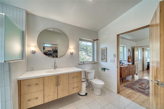 6644 County Road 110, Salida, CO 81201 - bathroom with vanity, lofted ceiling, and tile patterned floors