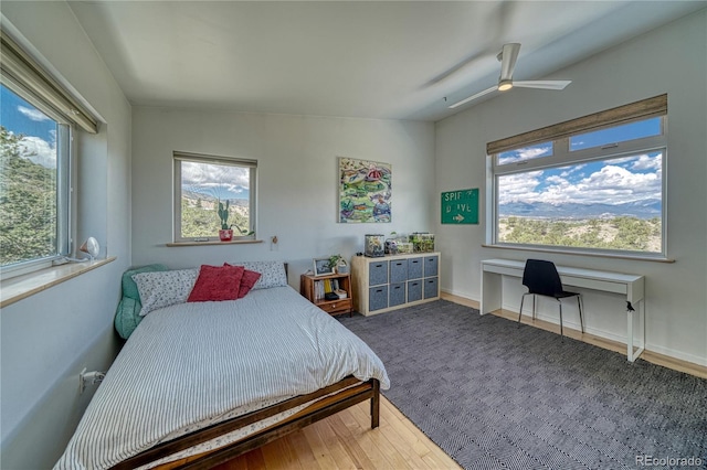 6644 County Road 110, Salida, CO 81201 - bedroom with a ceiling fan and wood finished floors