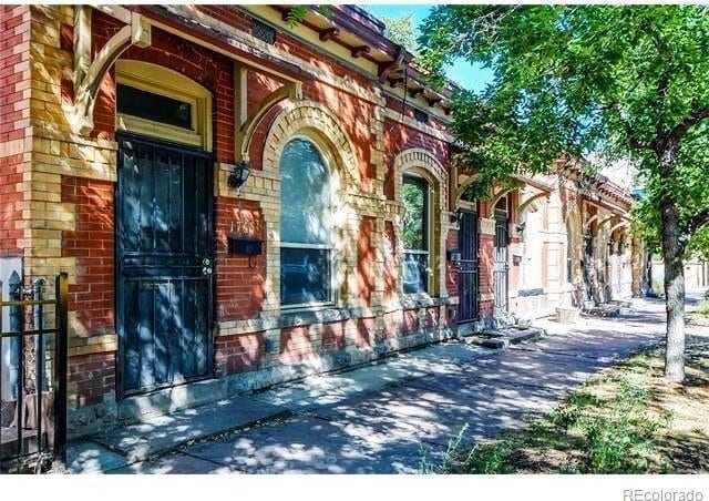 1767 N Washington St, Denver, CO 80203 - property entrance featuring brick siding