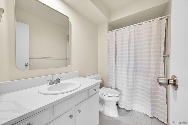 bathroom with curtained shower, toilet, vanity, and tile patterned flooring