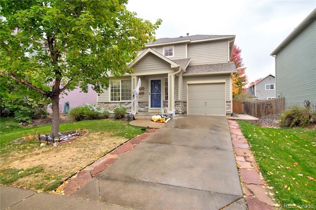 front facade featuring a front yard and a garage