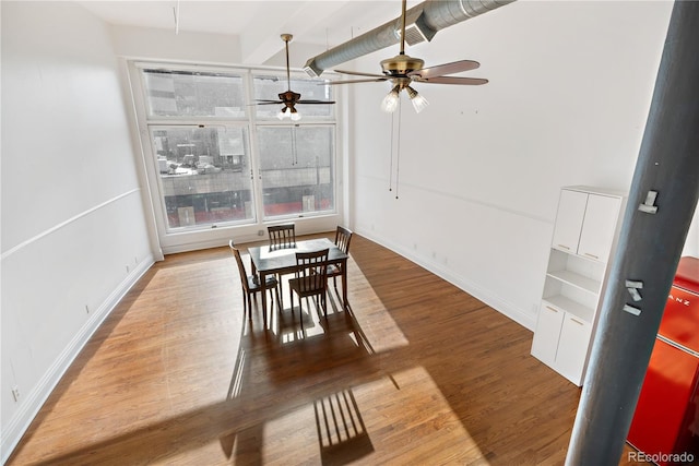 dining area featuring hardwood / wood-style floors and ceiling fan