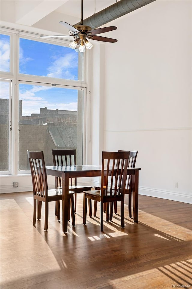 dining room featuring ceiling fan and light wood-type flooring