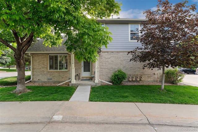 1385 W 112th Ave Unit D, Denver, CO 80234 - view of front of house with brick siding and a front yard