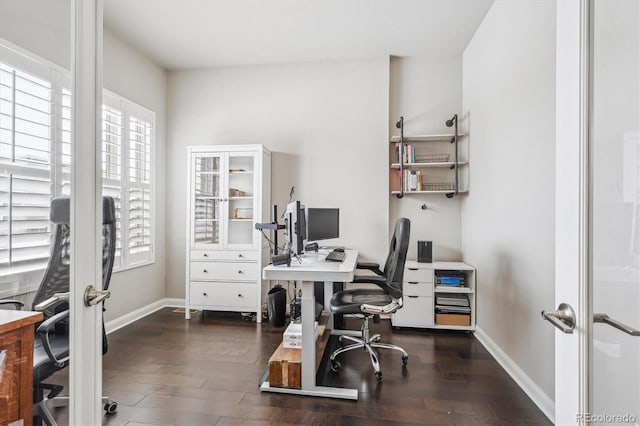 home office with dark wood-style floors and baseboards