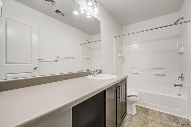 3386 Valentia St, Denver, CO 80238 - bathroom with toilet, vanity, bathing tub / shower combination, and tile patterned flooring