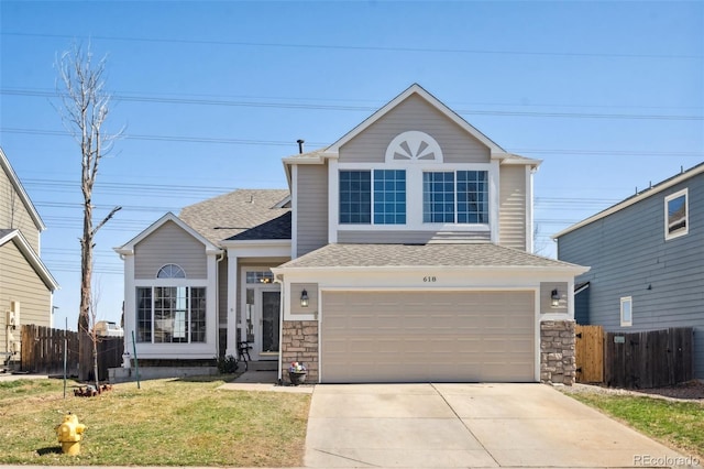 traditional home featuring driveway, stone siding, fence, an attached garage, and a shingled roof