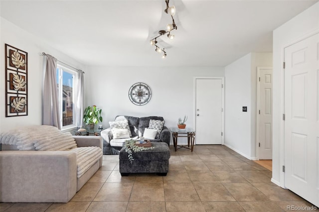 living room featuring light tile patterned floors and baseboards