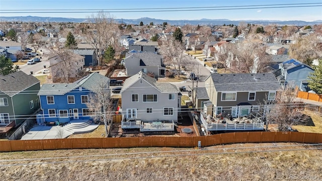 birds eye view of property with a mountain view and a residential view