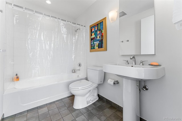 bathroom with visible vents, baseboards, toilet, shower / bath combo with shower curtain, and tile patterned floors