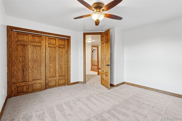 unfurnished bedroom with ceiling fan and light carpet