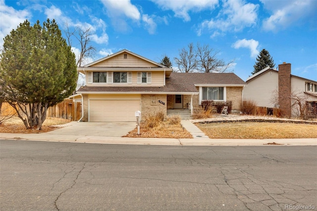 view of front of home featuring a garage, concrete driveway, brick siding, and fence