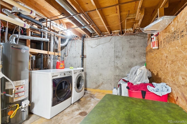 clothes washing area featuring separate washer and dryer and gas water heater