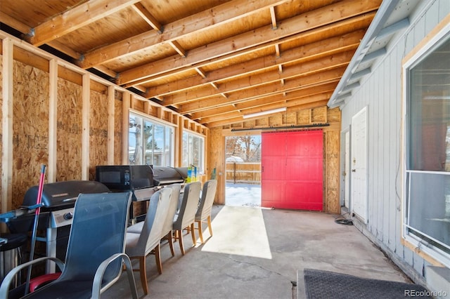 sunroom / solarium with vaulted ceiling