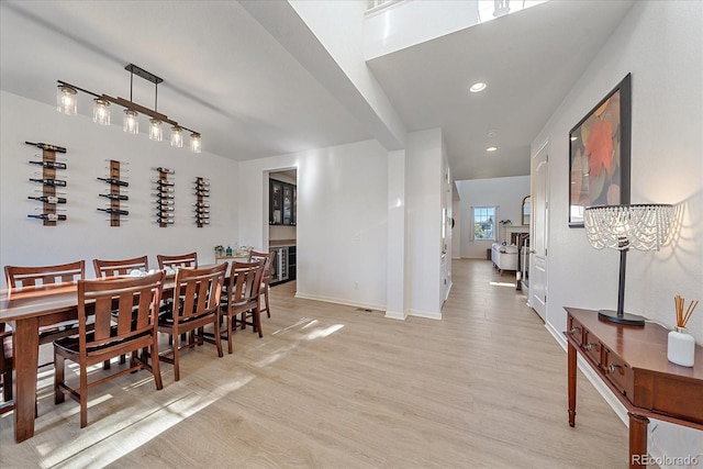 dining area featuring light wood-type flooring