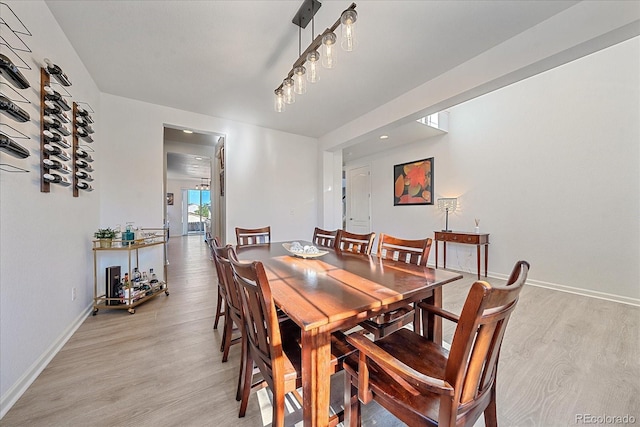 dining space with light wood-type flooring