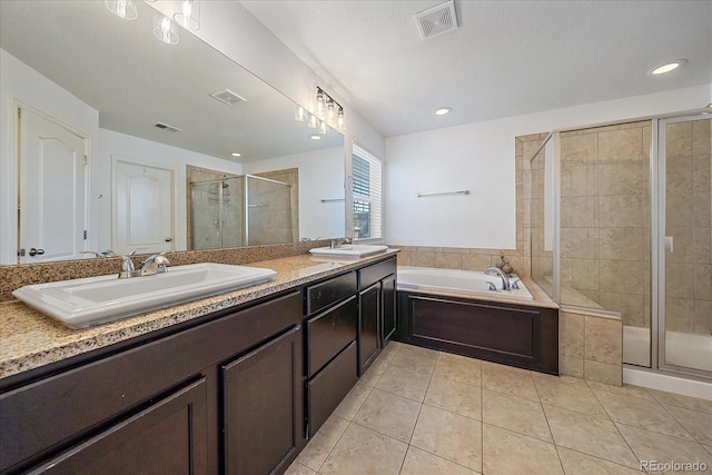 bathroom featuring vanity, separate shower and tub, and tile patterned flooring