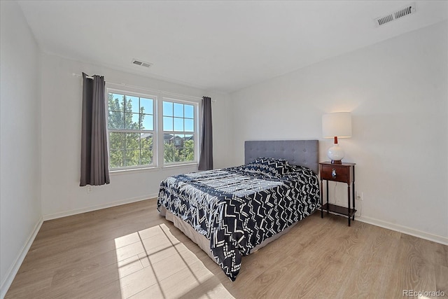 bedroom with wood-type flooring