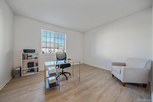 office space with light hardwood / wood-style flooring