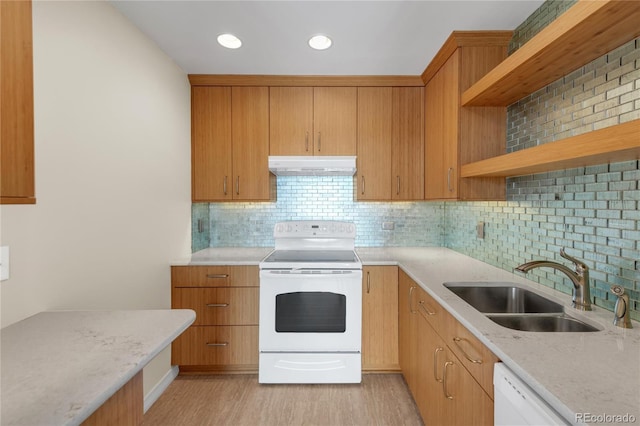 kitchen with sink, decorative backsplash, white appliances, light stone countertops, and light wood-type flooring