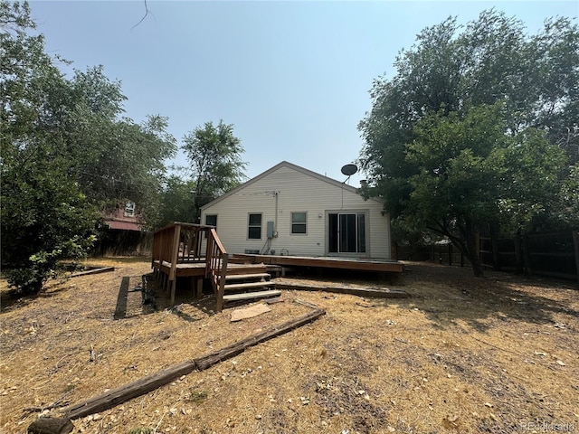 back of property with a wooden deck