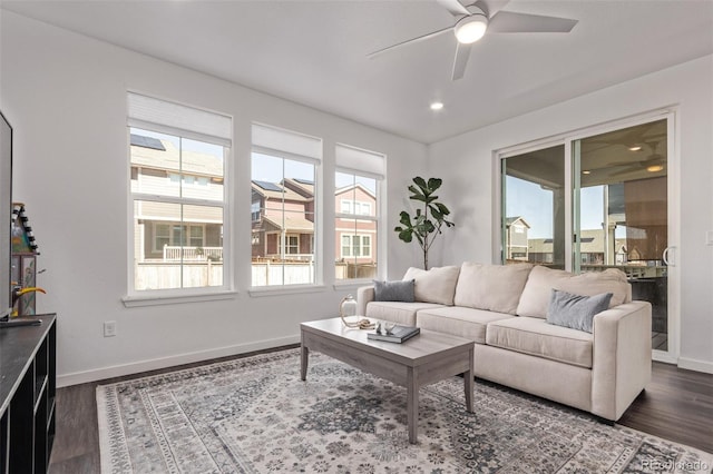 living room with baseboards, recessed lighting, dark wood finished floors, and ceiling fan