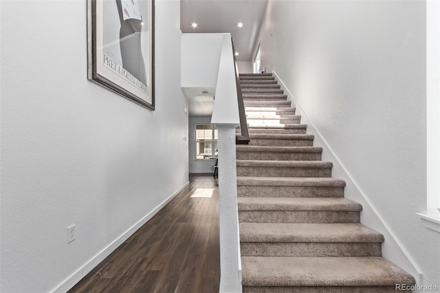 723 176th Ave, Broomfield, CO 80023 - stairway featuring baseboards, wood finished floors, and a high ceiling