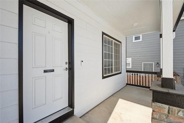 doorway to property with a porch