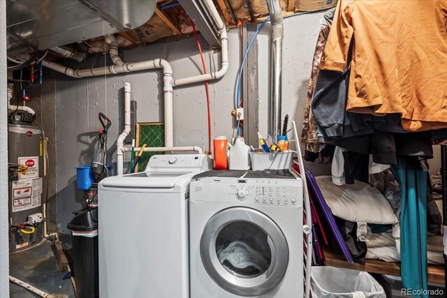 15800 E 121st Ave Unit 4K, Brighton, CO 80603 - washroom featuring water heater and separate washer and dryer