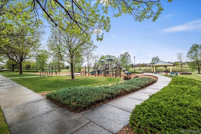 15800 E 121st Ave Unit 4K, Brighton, CO 80603 - community play area featuring a yard and a gazebo