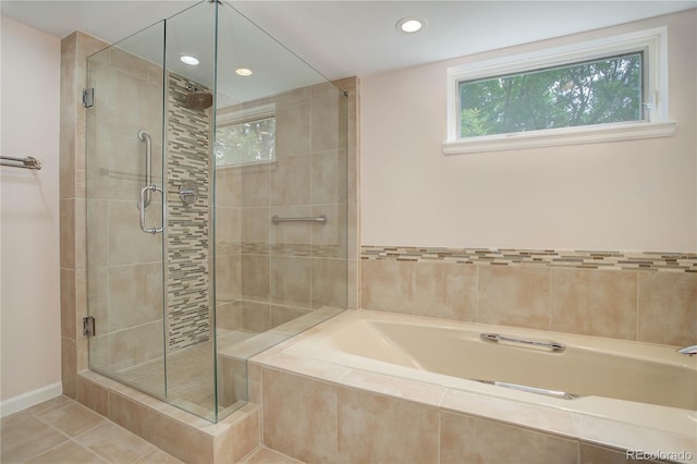 bathroom featuring recessed lighting, a shower stall, tile patterned flooring, baseboards, and a bath