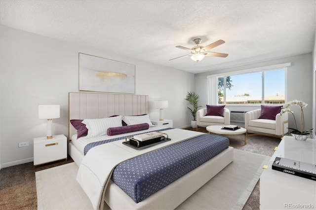 bedroom with ceiling fan, a textured ceiling, and carpet floors