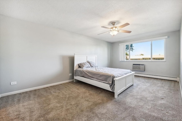 bedroom with baseboard heating, ceiling fan, carpet, a textured ceiling, and a wall mounted air conditioner