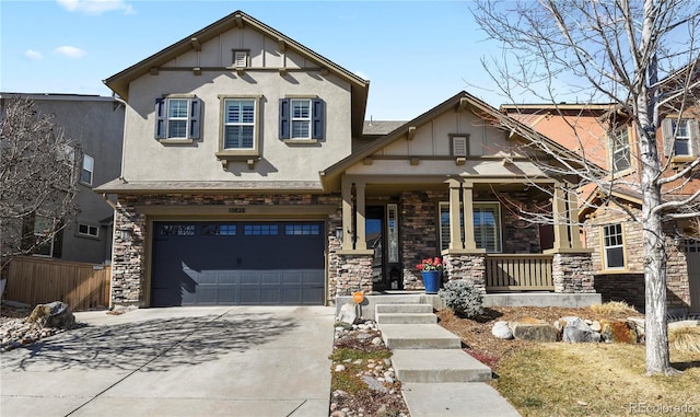 view of front of property featuring a porch, stone siding, driveway, and stucco siding