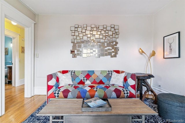 living room featuring baseboards and wood finished floors
