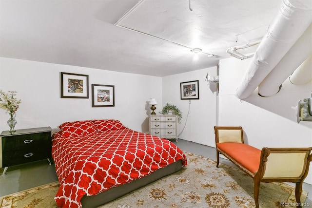 bedroom with concrete floors