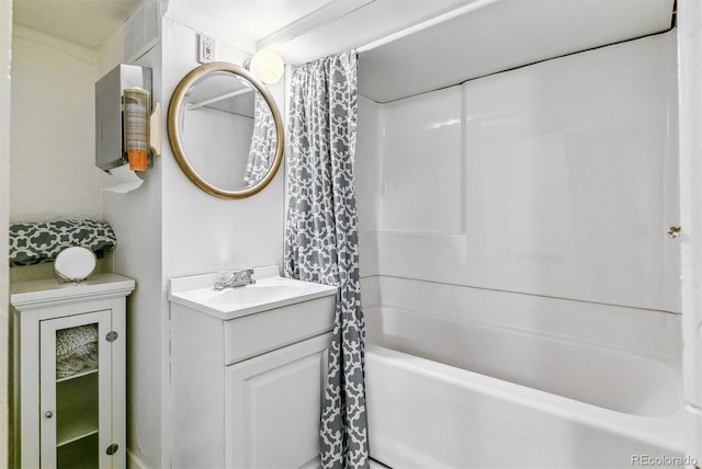 bathroom featuring shower / bath combination with curtain and vanity