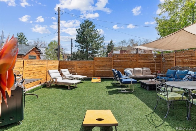 view of yard featuring a fenced backyard and outdoor lounge area