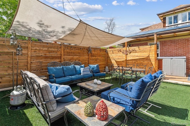 view of patio with fence, outdoor lounge area, and outdoor dining area
